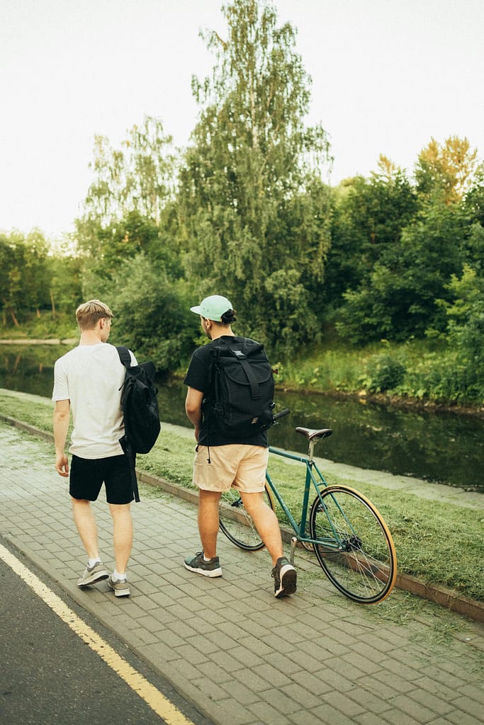 Two students ride bicycles, enjoying the outdoor activities and natural beauty near Lincoln University.
